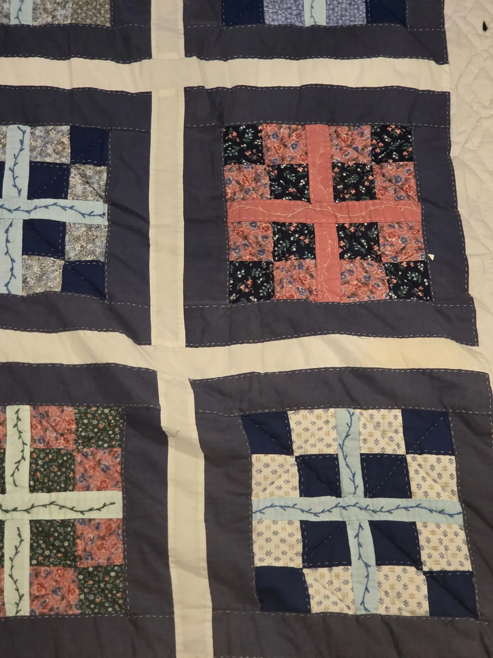 Patchwork Navy and Cream Quilt with Blue and Coral Accents